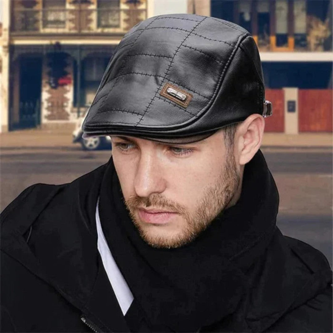 Man wearing a black quilted cap with a blurred background